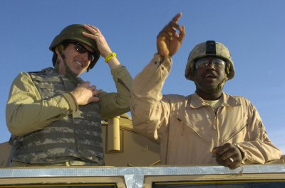 Minnesota Governor Tim Pawlenty fastens his helmet before going on a ride in an Armored Security Veh...