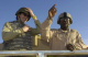 Minnesota Governor Tim Pawlenty fastens his helmet before going on a ride in an Armored Security Veh...