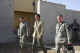 SPC Maurer and SPC Harker of Bravo Company 2-211 walk with Minnesota Governor Tim Pawlenty on the fl...