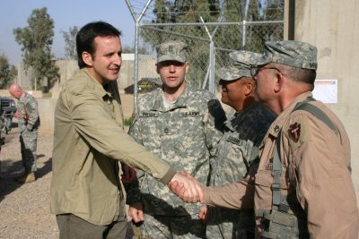 Governor Tim Pawlenty shakes hands with flight engineer SSG Joel Minks of Bravo Company 2-211.  SSG ...