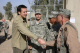 Governor Tim Pawlenty shakes hands with flight engineer SSG Joel Minks of Bravo Company 2-211.  SSG ...