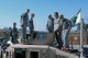 Governor Pawlenty examines a Humvee belonging to members of the Minnesota National Guard during a st...