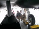 Col Frank Stokes, of the Duluth-based 148th Fighter Wing, shows Governor Tim Pawlenty an F-15E Strik...