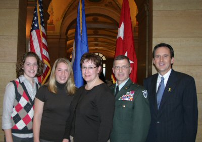 Governor Pawlenty poses for a photo with Brigadier General Joe Kelly and his family following Genera...