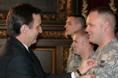 Governor Pawlenty presents awards at the Minnesota National Guard Reintegration Awards Ceremony, whi...