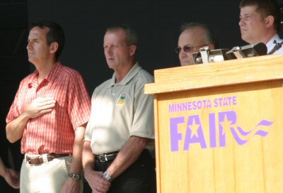 Governor Pawlenty salutes the flag as he participates at the Governor's Council on Fire Prevention a...