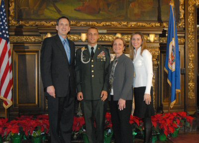 Governor Pawlenty and First Lady Mary Pawlenty visit with Staff Sgt. Chad Malmberg and his mother.  ...