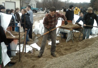 Governor Pawlenty assists in flood preparation efforts during his visit to the Moorhead area. Govern...